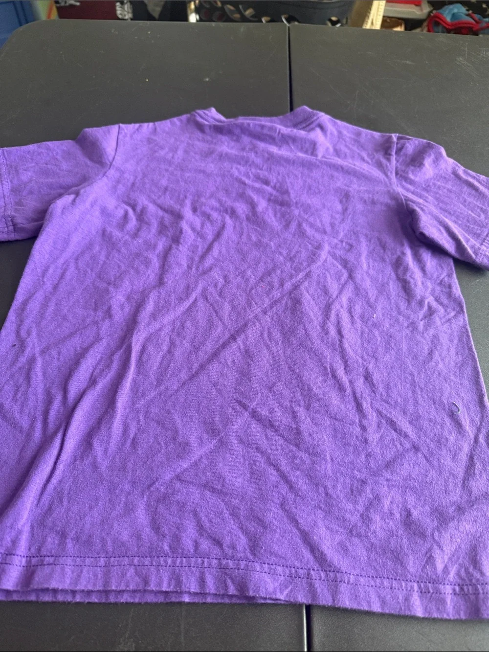 Nike Kids Purple Graphic Tee with White 'Unleash Speed' Logo
